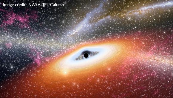 איור של דיסקת גז המזינה חור שחור מסיבי, תוך פליטת קרינה